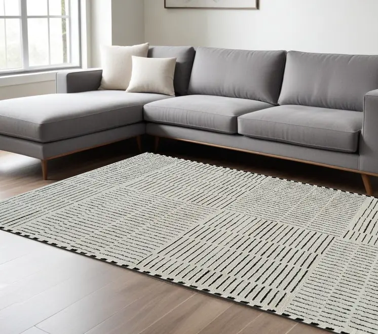 8' X 11' Cream and Black Abstract Distressed Area Rug
