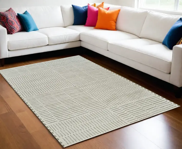 5' X 8' Cream and Green Abstract Worn Faded Area Rug