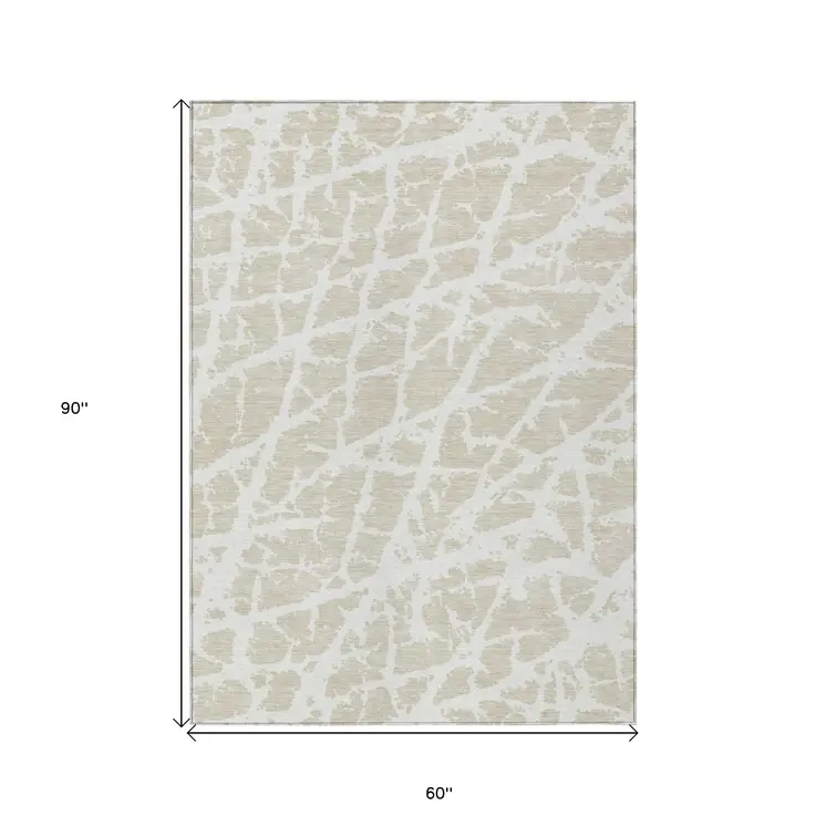 5' X 8' Beige and Ivory Abstract Washable Non Skid Indoor Outdoor Area Rug