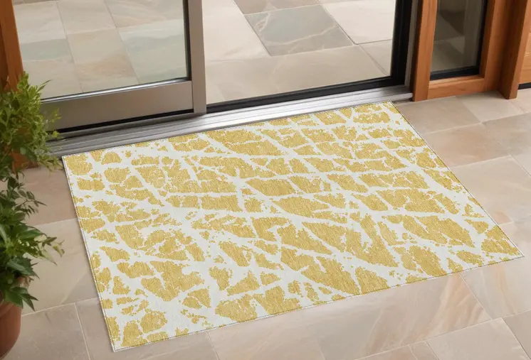 2' X 3' Gold and White Abstract Washable Non Skid Indoor Outdoor Area Rug