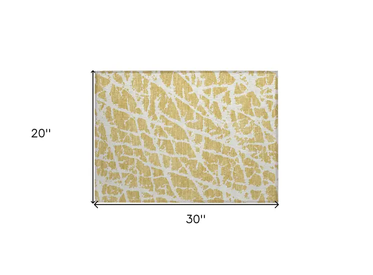 2' X 3' Gold and White Abstract Washable Non Skid Indoor Outdoor Area Rug