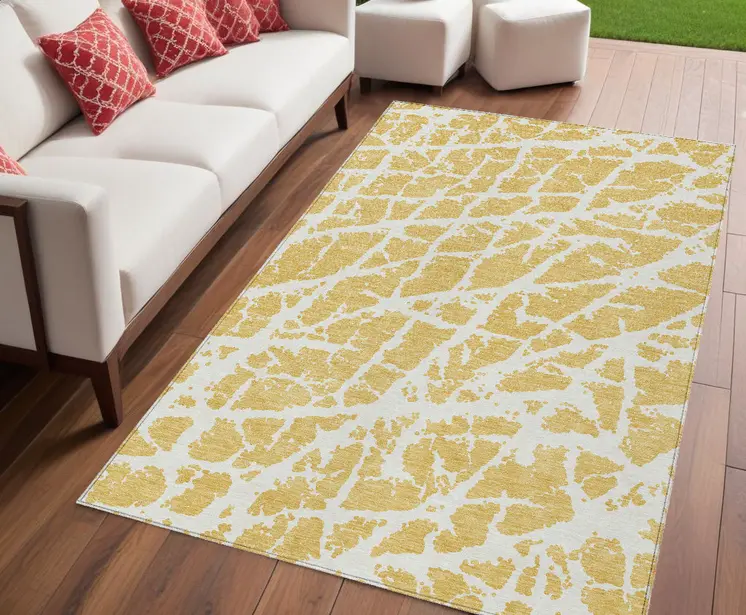 5' X 8' Gold and White Abstract Washable Non Skid Indoor Outdoor Area Rug