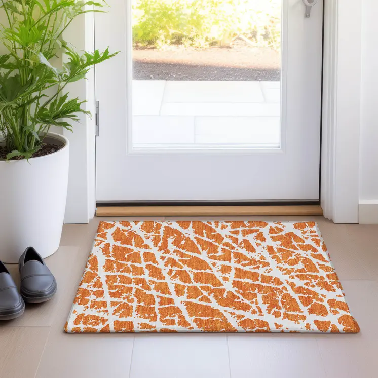 2' X 3' Orange and White Abstract Washable Non Skid Indoor Outdoor Area Rug