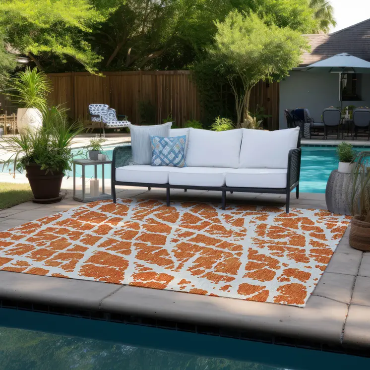 9' X 12' Orange and White Abstract Washable Non Skid Indoor Outdoor Area Rug