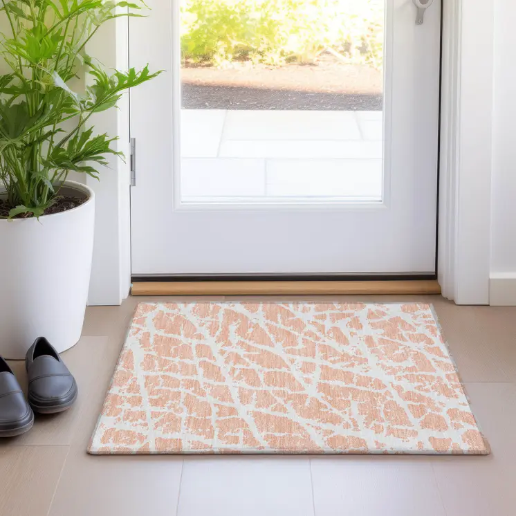 2' X 3' Peach and Ivory Abstract Washable Non Skid Indoor Outdoor Area Rug