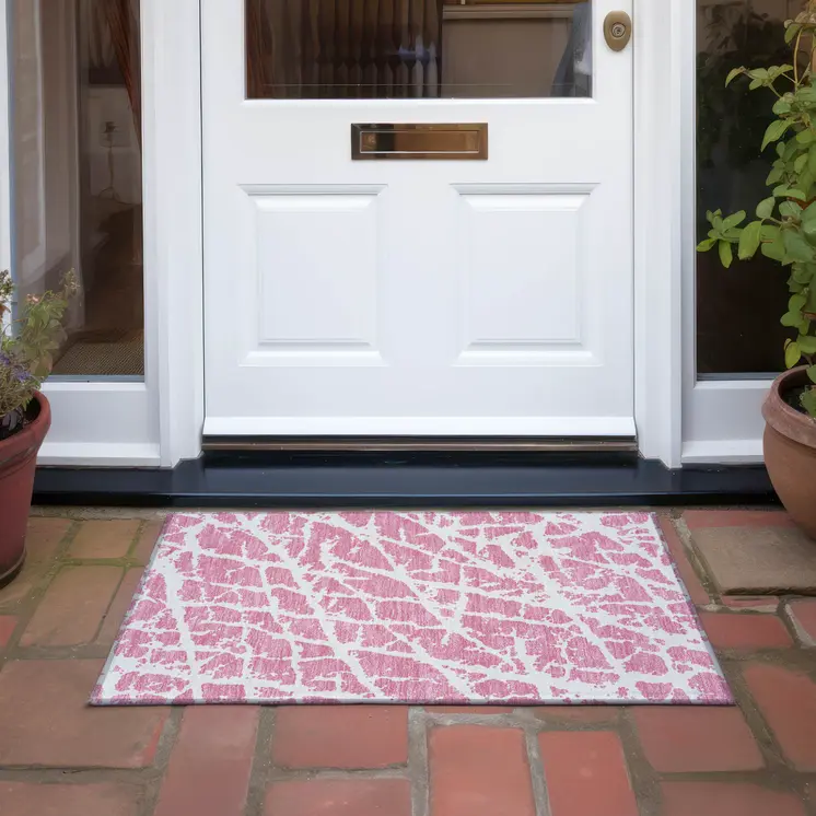 2' X 3' Pink and Ivory Abstract Washable Non Skid Indoor Outdoor Area Rug