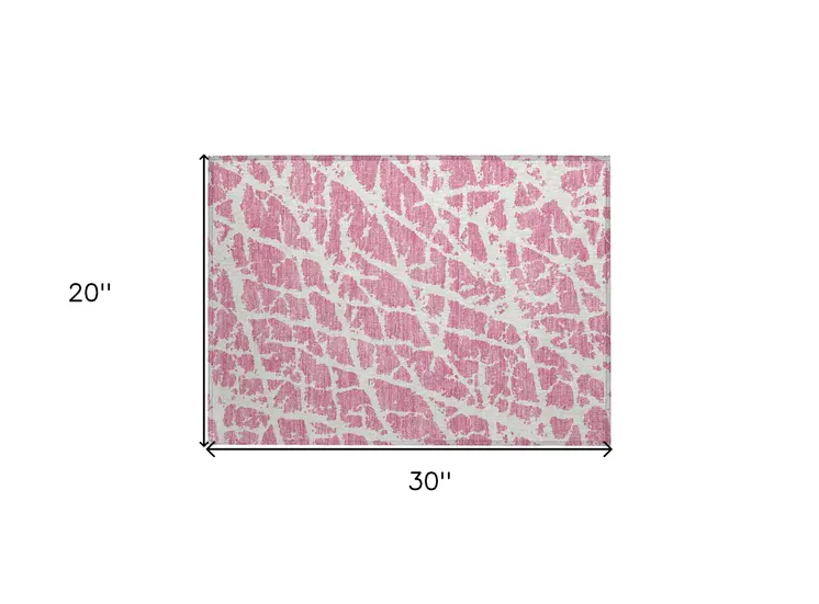 2' X 3' Pink and Ivory Abstract Washable Non Skid Indoor Outdoor Area Rug