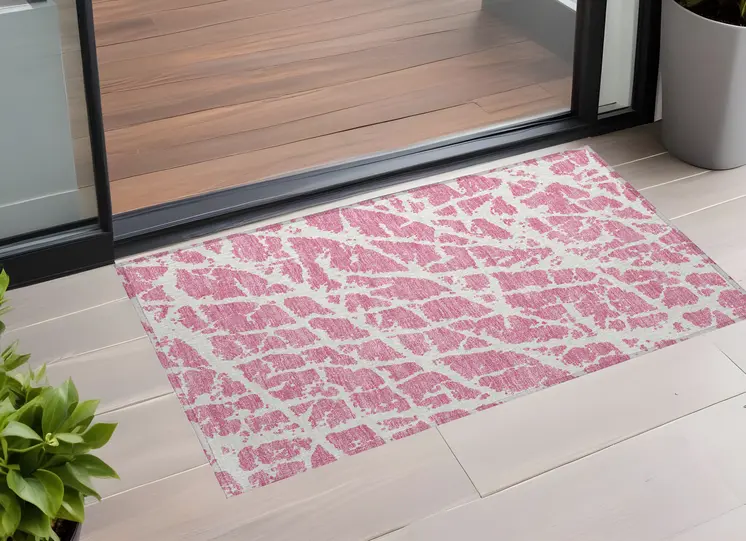 3' X 5' Pink and Ivory Abstract Washable Non Skid Indoor Outdoor Area Rug