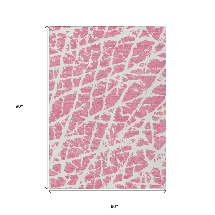 5' X 8' Pink and Ivory Abstract Washable Non Skid Indoor Outdoor Area Rug