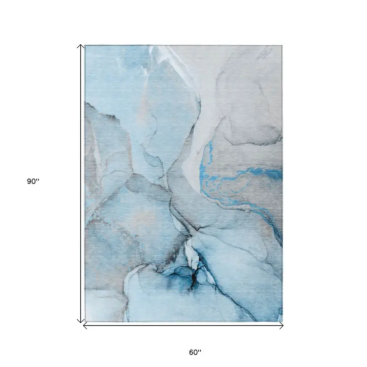 5' X 8' Blue and Ivory Abstract Washable Non Skid Indoor Outdoor Area Rug