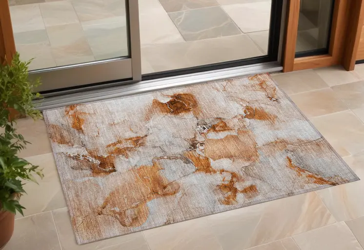 2' X 3' Orange and Ivory Abstract Washable Indoor Outdoor Area Rug