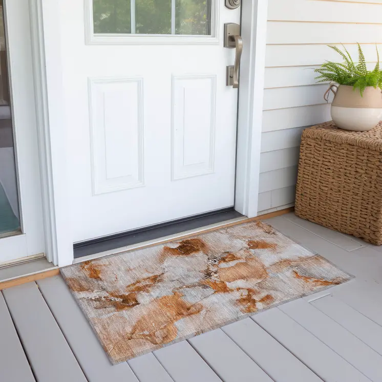 2' X 3' Orange and Ivory Abstract Washable Indoor Outdoor Area Rug