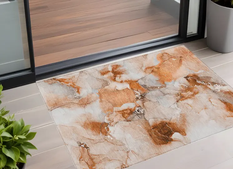 3' X 5' Orange and Ivory Abstract Washable Non Skid Indoor Outdoor Area Rug
