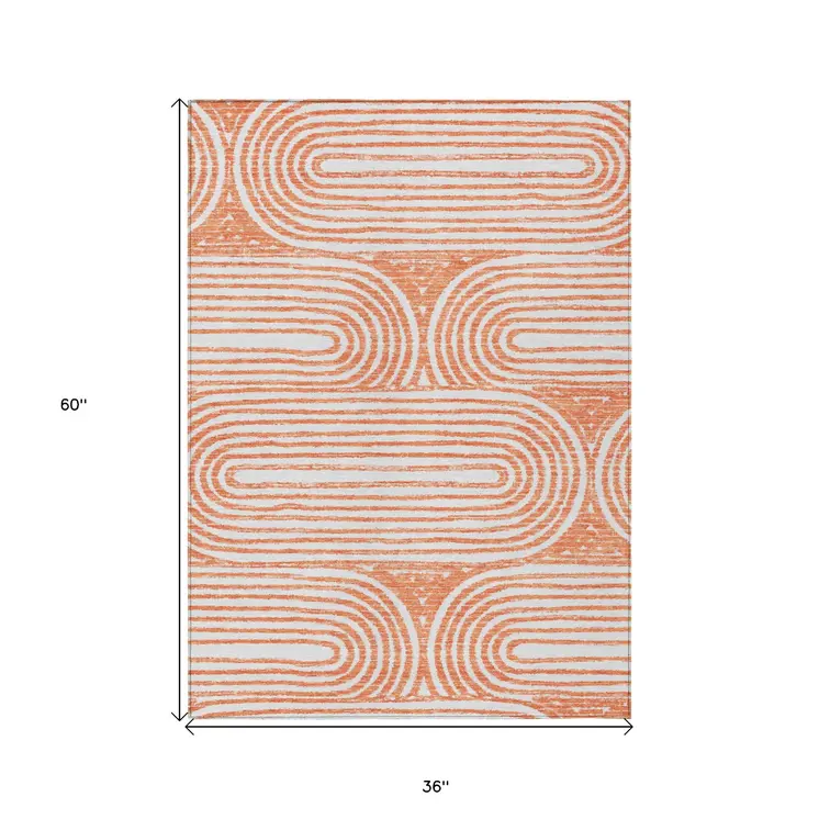 3' X 5' Orange and Ivory Abstract Washable Non Skid Indoor Outdoor Area Rug