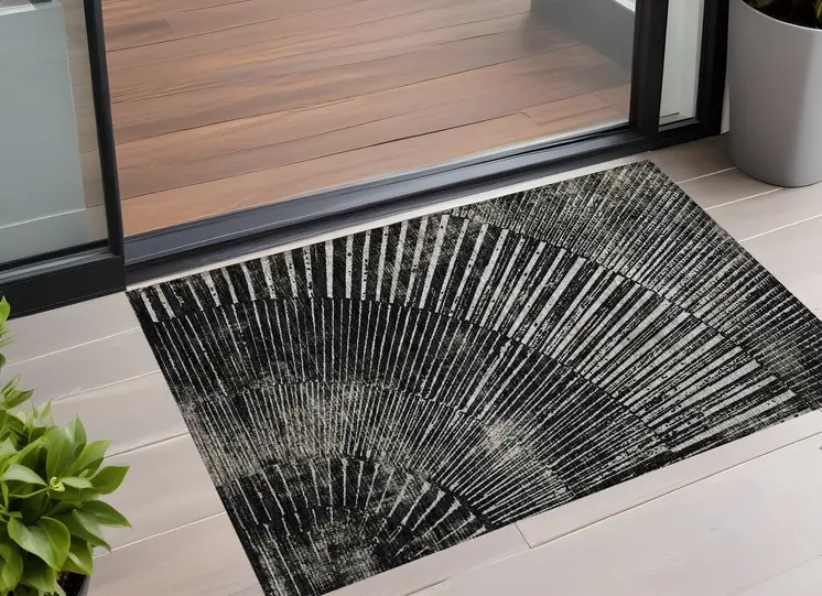 2' X 3' Black and Ivory Abstract Washable Non Skid Indoor Outdoor Area Rug