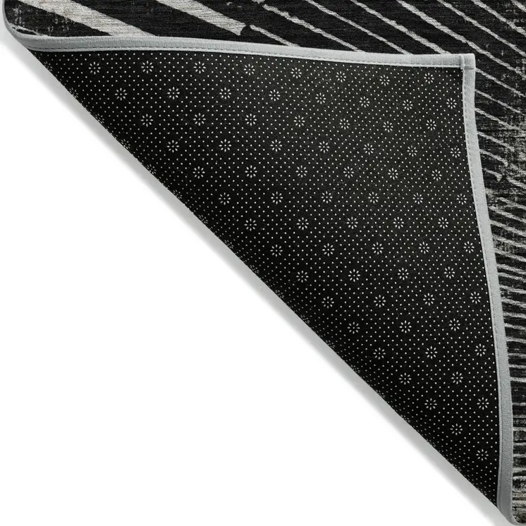 8' X 10' Black and Ivory Abstract Washable Non Skid Indoor Outdoor Area Rug