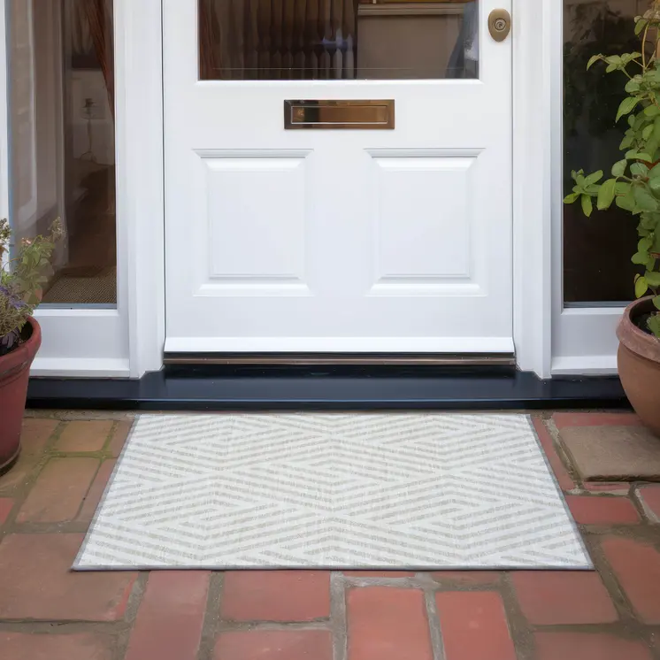 2' X 3' Beige and Ivory Geometric Washable Non Skid Indoor Outdoor Area Rug