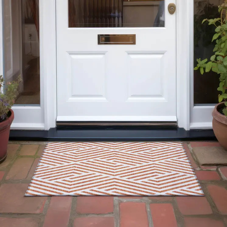 2' X 3' Orange and White Geometric Washable Non Skid Indoor Outdoor Area Rug