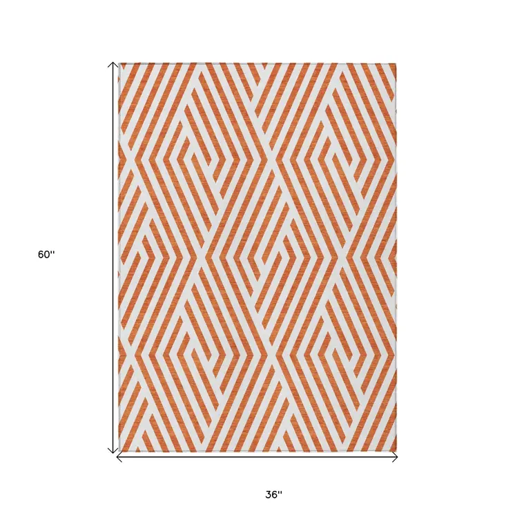 3' X 5' Orange And White Geometric Washable Indoor Outdoor Area Rug