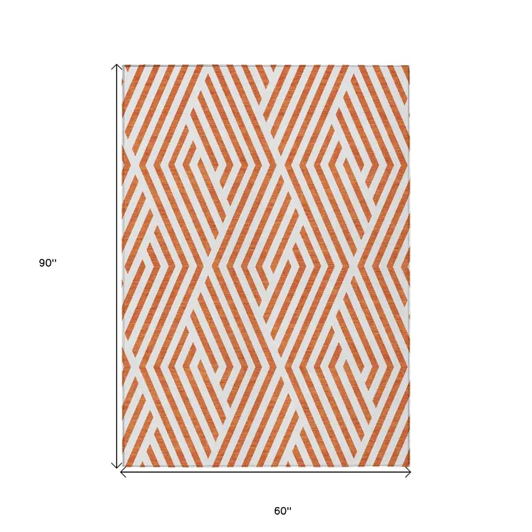 5' X 8' Orange And White Geometric Washable Indoor Outdoor Area Rug