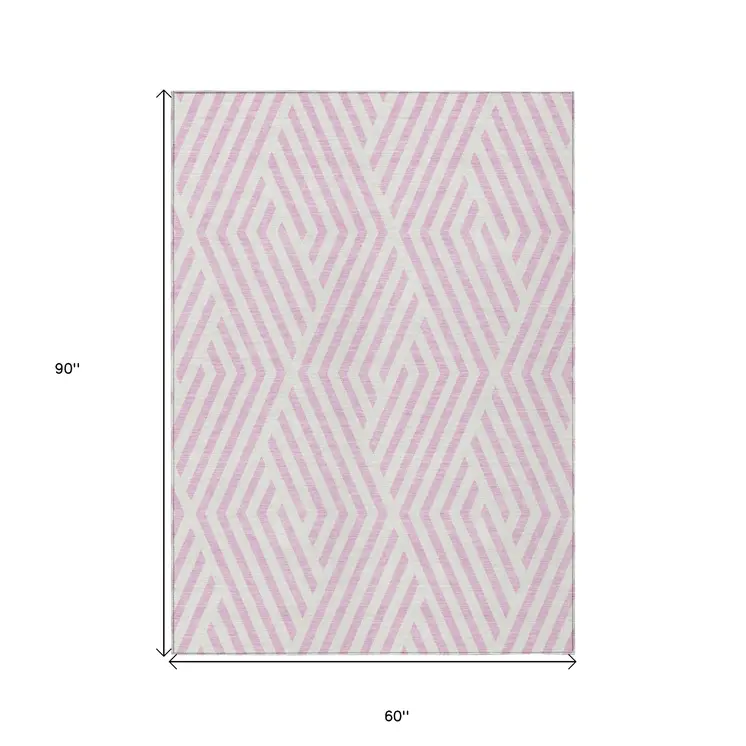 5' X 8' Pink and White Geometric Washable Non Skid Indoor Outdoor Area Rug