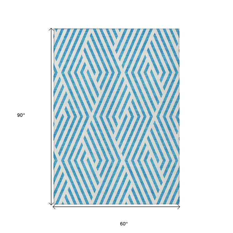 5' X 8' Teal and White Geometric Washable Non Skid Indoor Outdoor Area Rug