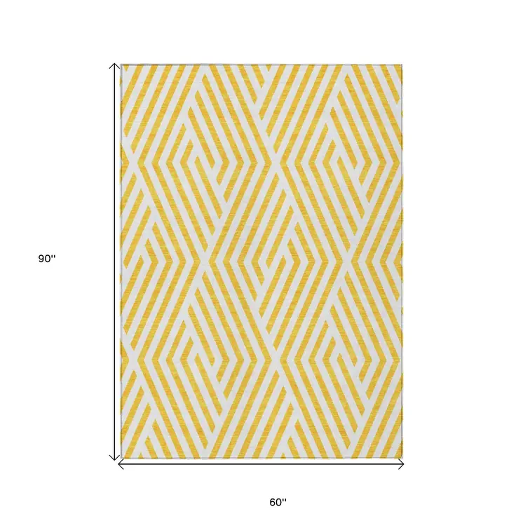 5' X 8' Gold and White Geometric Washable Non Skid Indoor Outdoor Area Rug