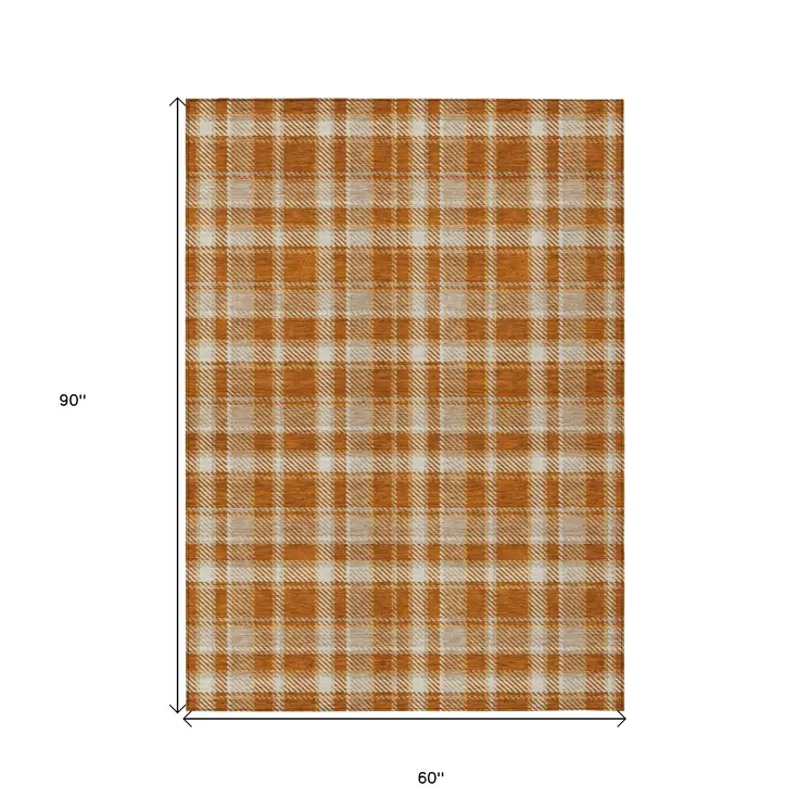 5' X 8' Orange and Ivory Plaid Washable Non Skid Indoor Outdoor Area Rug