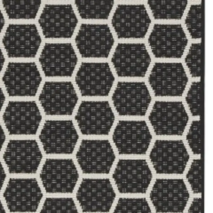 8' Black And Ivory Geometric Indoor Outdoor Runner Rug