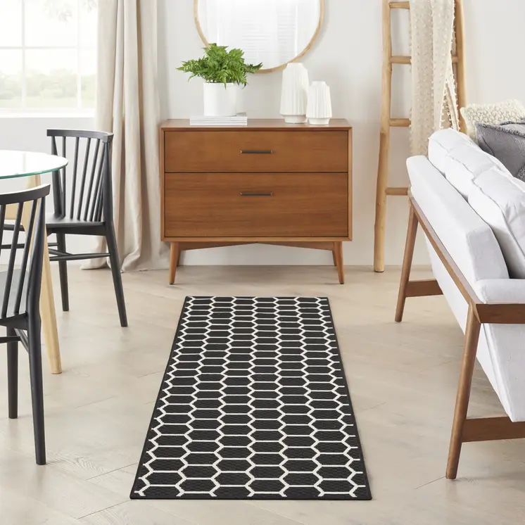 8' Black And Ivory Geometric Indoor Outdoor Runner Rug
