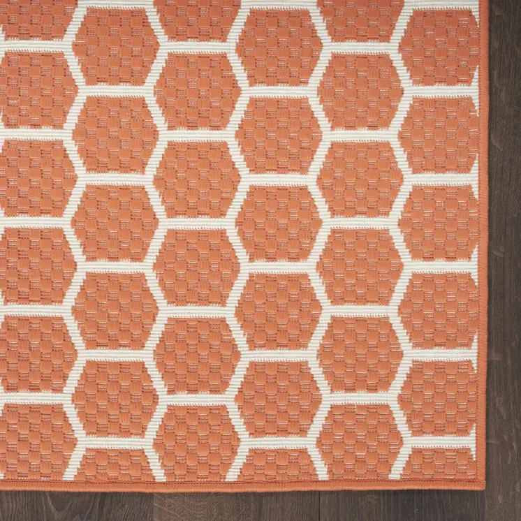 10' Coral And White Geometric Indoor Outdoor Runner Rug