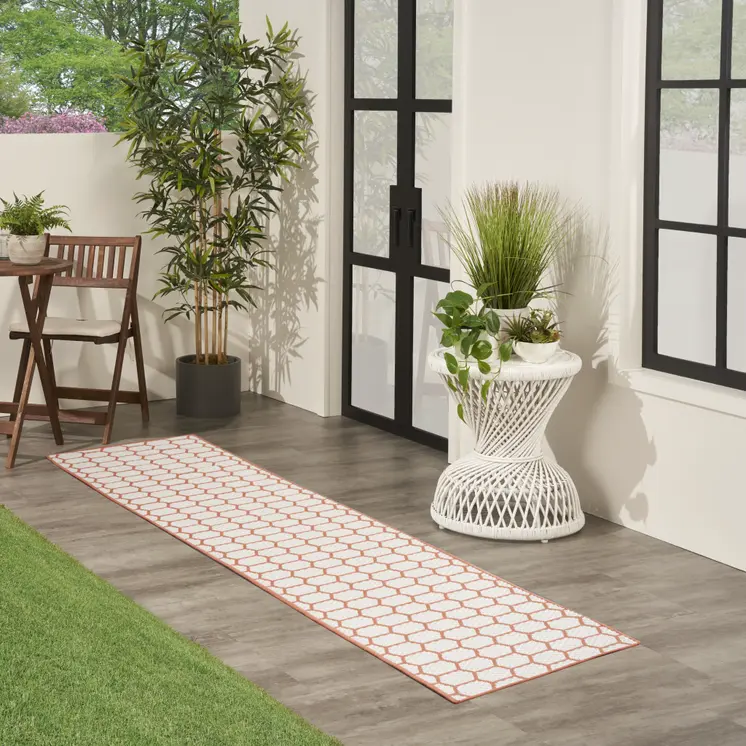 10' Coral And White Geometric Indoor Outdoor Runner Rug