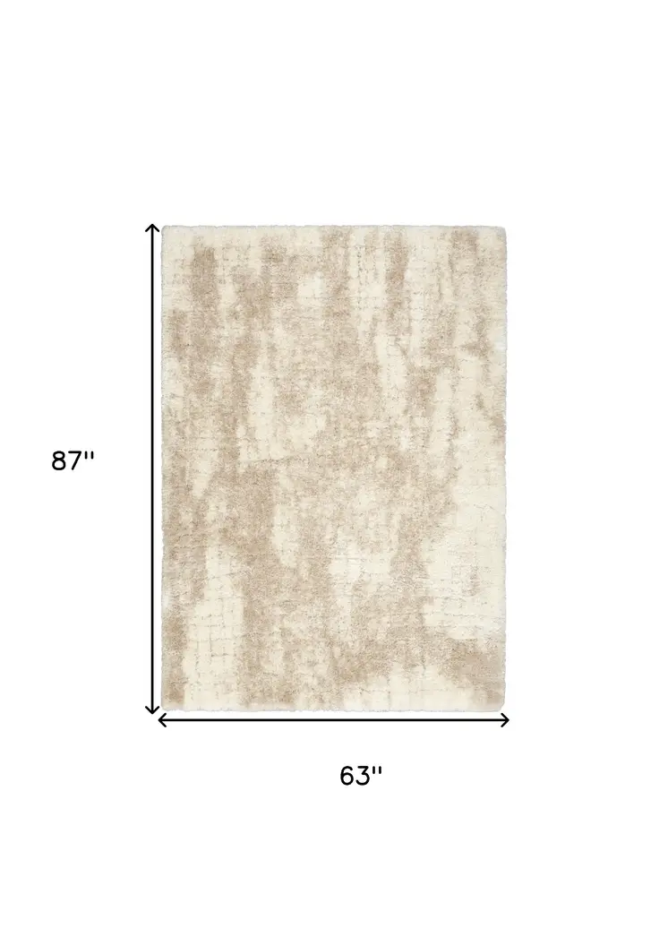 5' X 7' Beige and Ivory Abstract Shag Area Rug