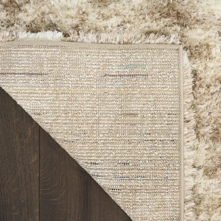5' X 7' Beige and Ivory Abstract Shag Area Rug