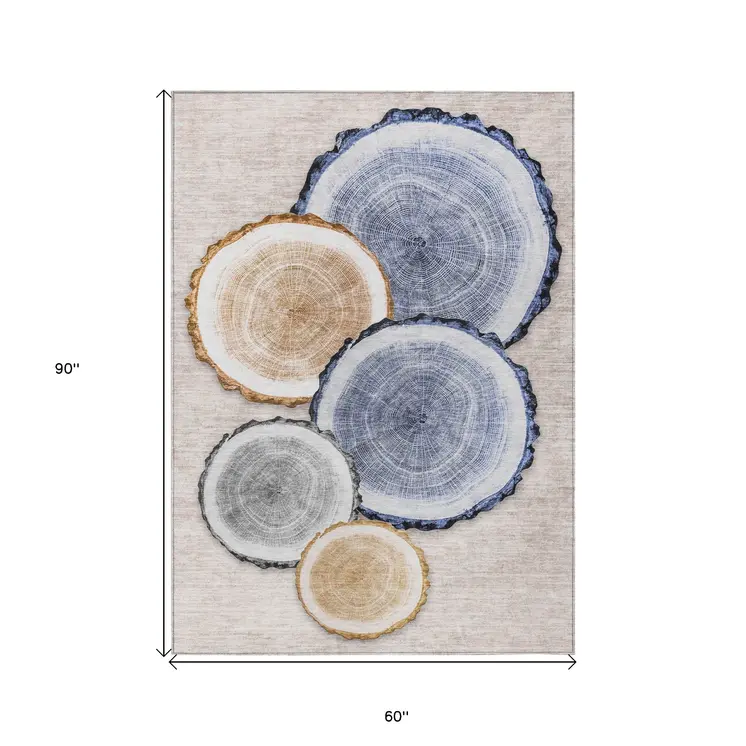 5' X 8' Beige Blue And Gold Faux Bois Washable Indoor Outdoor Area Rug