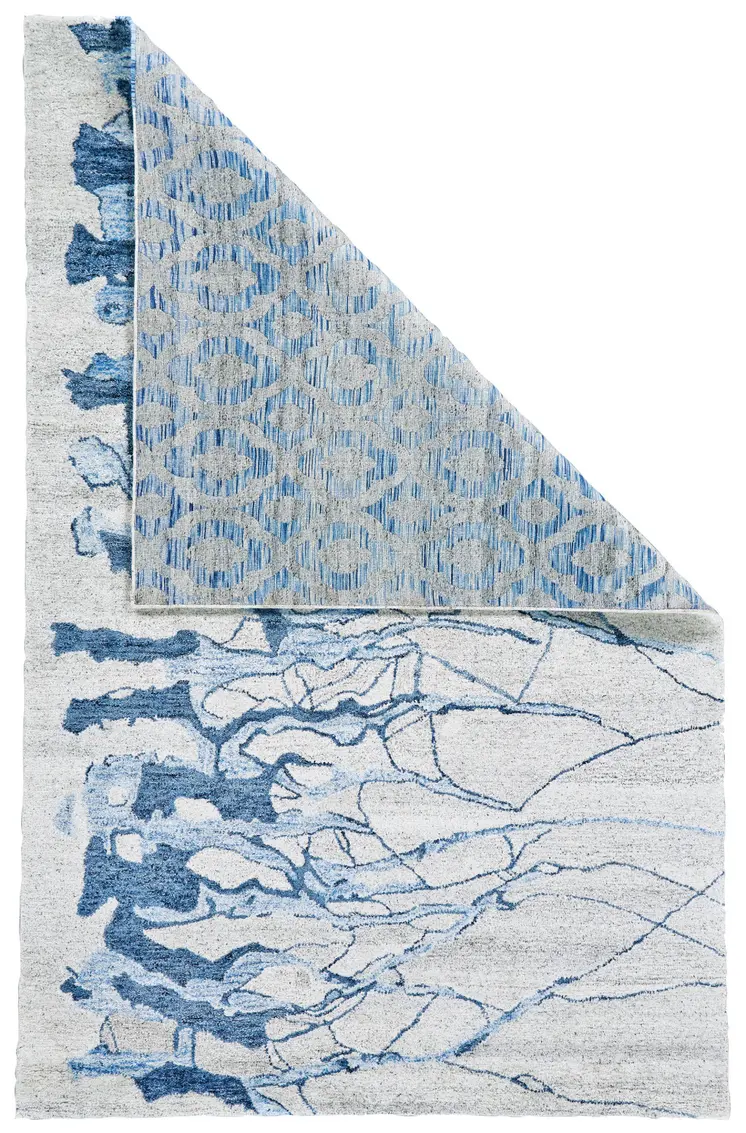 7' X 9' Blue and Ivory Abstract Hand Tufted Area Rug