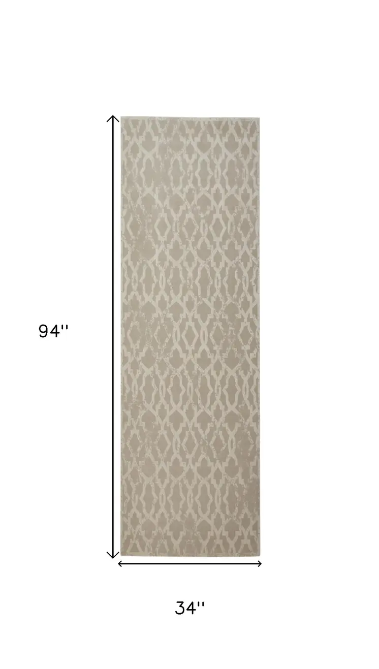 8' Tan and Ivory Geometric Power Loom Worn Faded Runner Rug