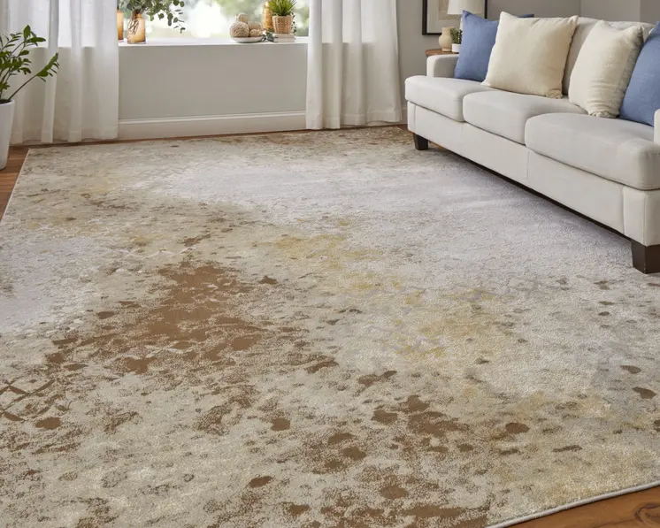 2' X 3' Tan and Ivory Abstract Power Loom Worn Faded Area Rug