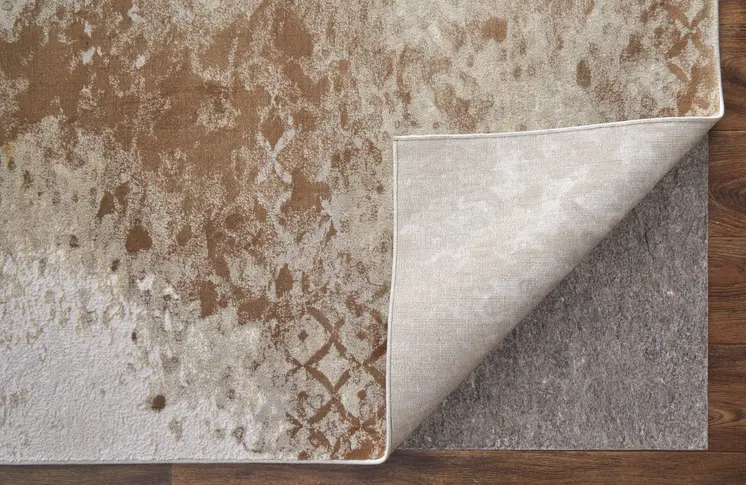 2' X 3' Tan and Ivory Abstract Power Loom Worn Faded Area Rug