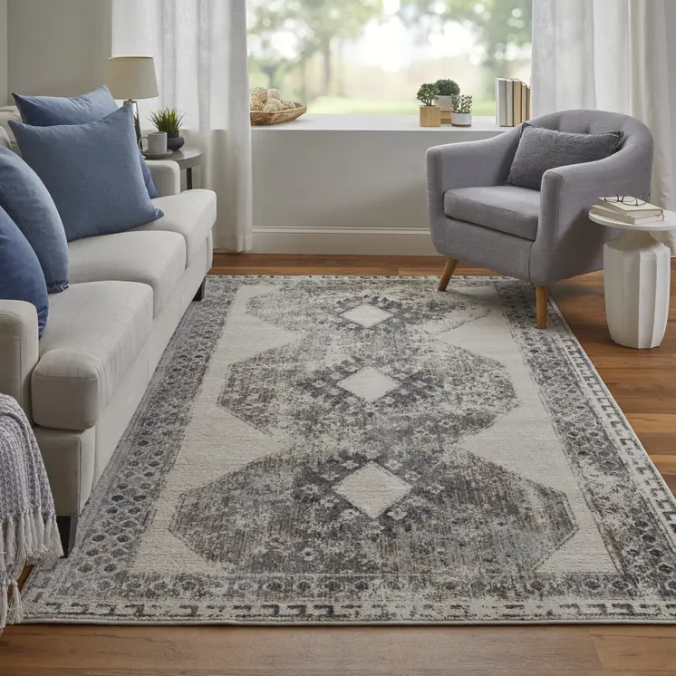 5' X 8' Gray and Ivory Abstract Power Loom Worn Faded Area Rug