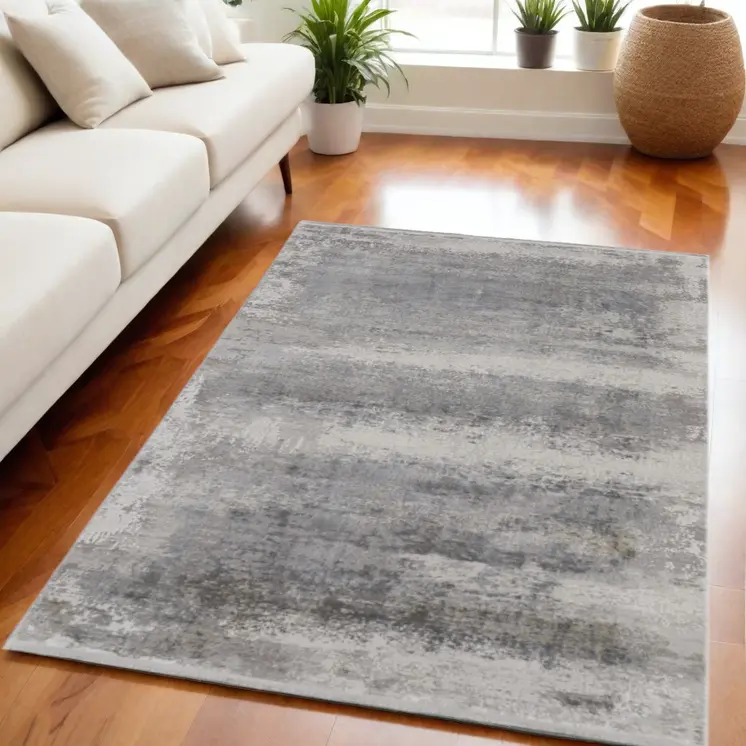 5' X 8' Gray Abstract Power Loom Area Rug With Fringe