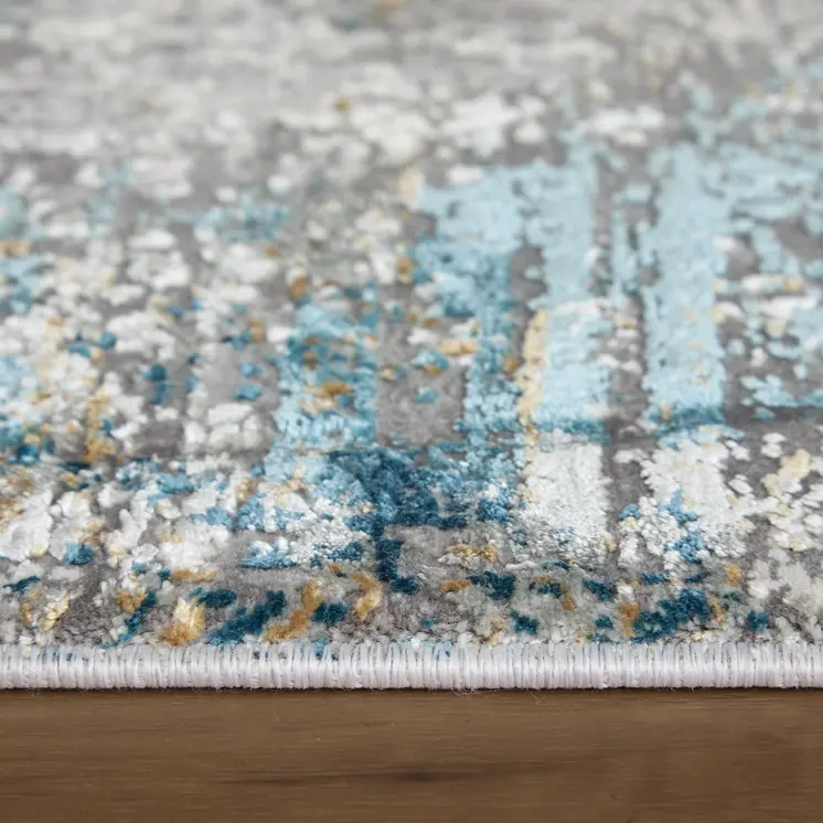 7' X 10' Ivory Gray and Blue Abstract Power Loom Area Rug With Fringe