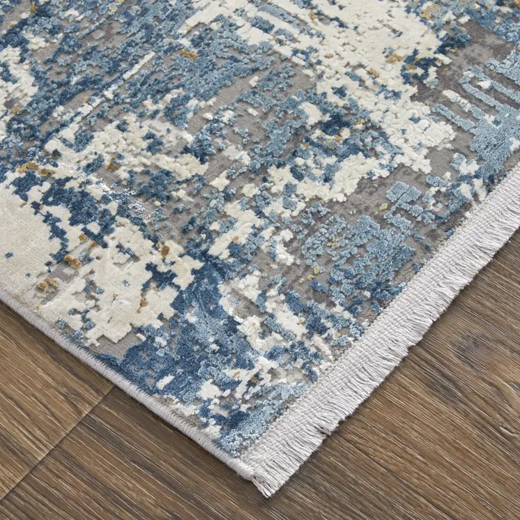 10' X 13' Ivory Tan and Blue Abstract Power Loom Area Rug With Fringe