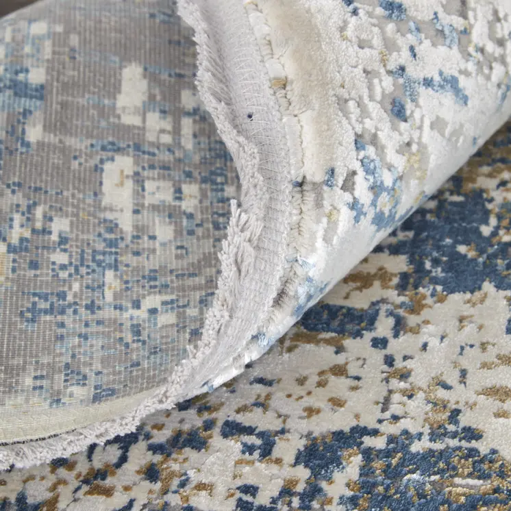 13' X 20' Ivory Tan and Blue Abstract Power Loom Area Rug With Fringe