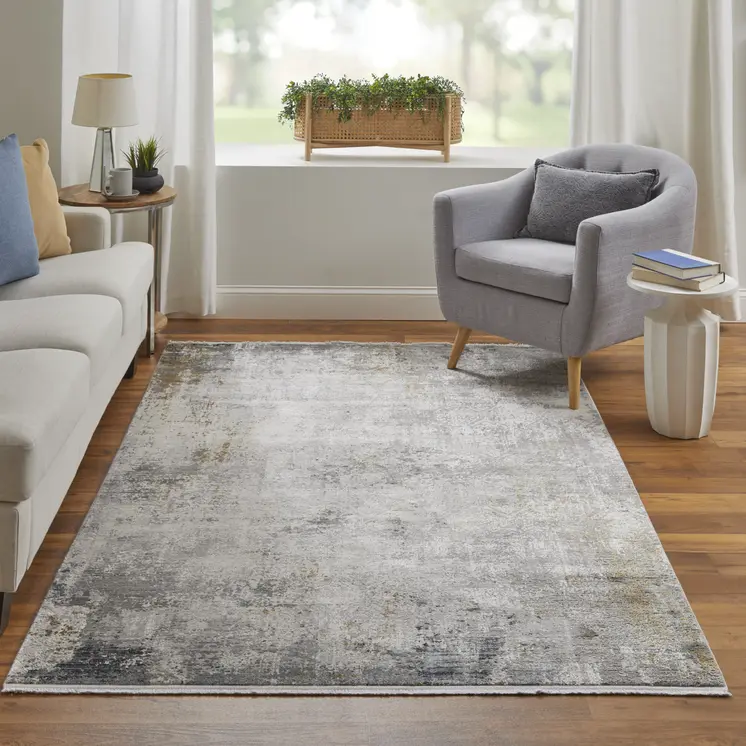 5' X 8' Ivory Taupe and Gray Abstract Power Loom Distressed Area Rug With Fringe