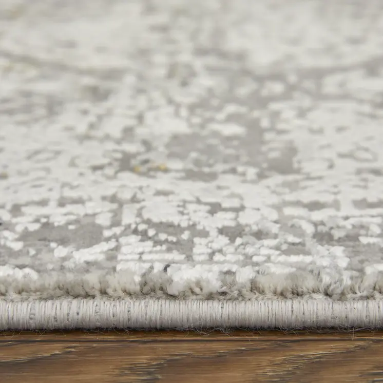 7' X 10' Ivory Taupe and Gray Abstract Power Loom Distressed Area Rug With Fringe