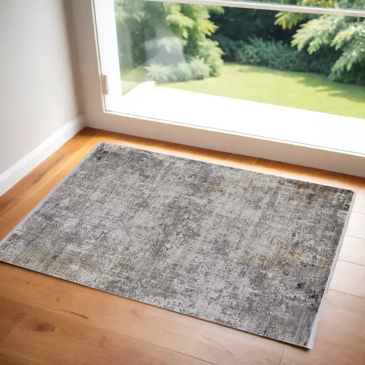 2' X 3' Ivory Taupe and Gray Abstract Power Loom Distressed Area Rug With Fringe