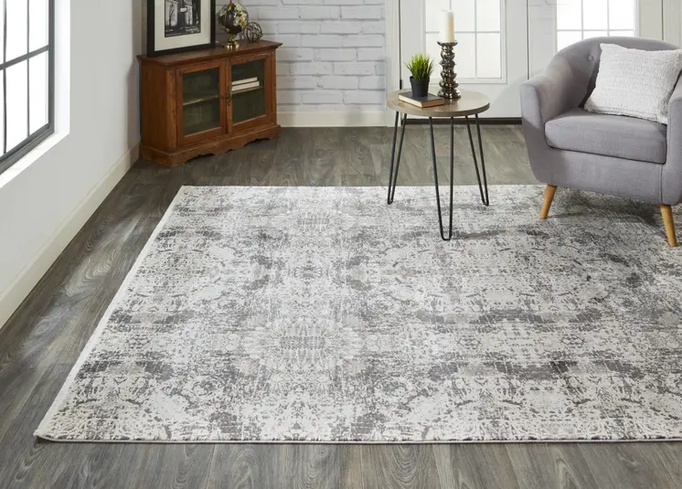 3' X 5' Ivory Taupe and Gray Abstract Power Loom Distressed Area Rug With Fringe