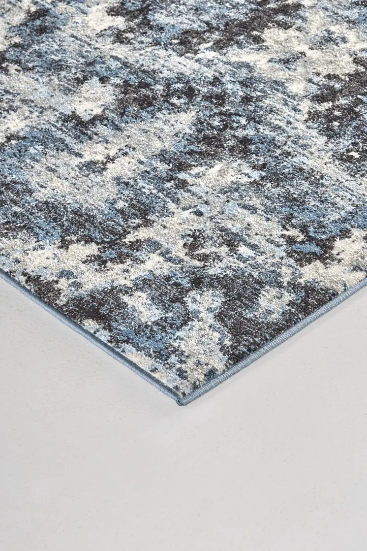5' X 8' Blue Black and Ivory Ikat Power Loom Area Rug