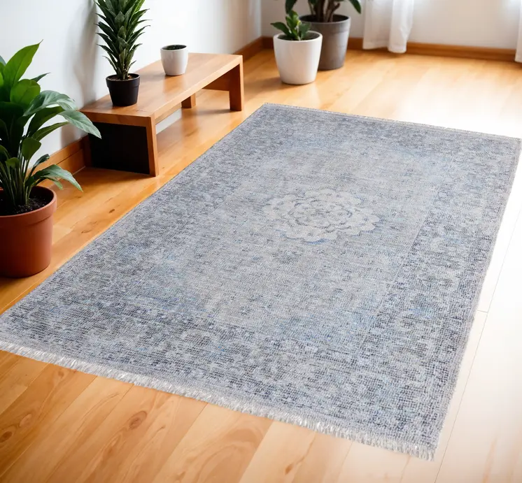 4' X 6' Gray Blue and Ivory Oriental Hand Woven Distressed Area Rug With Fringe